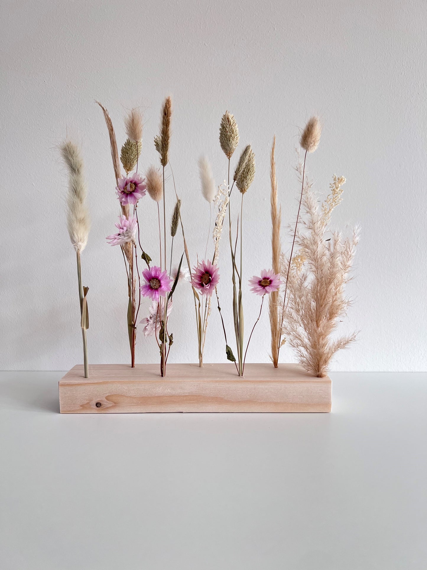 Dried flowers pink in holder